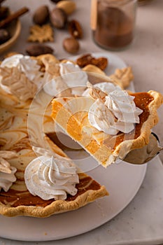 Pumpkin cheesecake swirl pie topped with whipped cream