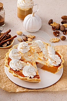 Pumpkin cheesecake swirl pie topped with whipped cream