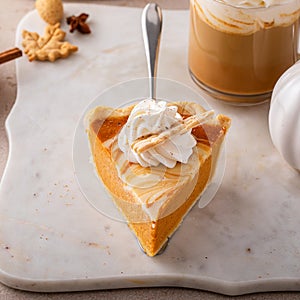 Pumpkin cheesecake swirl pie topped with whipped cream