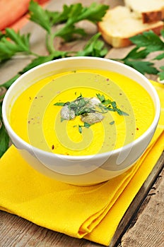 Pumpkin cream soup decorated seeds and herbs