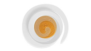 Pumpkin cream soup isolated on a white background.