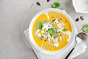 Pumpkin creamy soup served in bowl