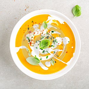 Pumpkin creamy soup served in bowl