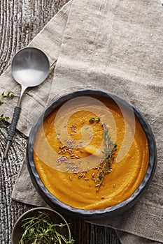 Pumpkin creme soup in a dark crockery