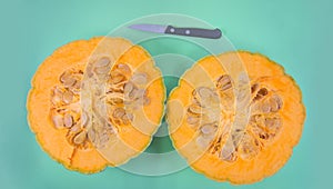 Pumpkin cut in two that retains its seeds