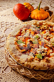 pumpkin galette, open pie for festive Thanksgiving family dinner. close up view