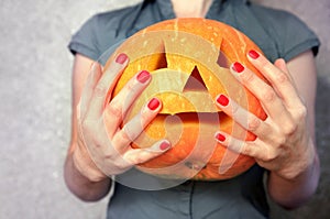 Pumpkin for Halloween in hands