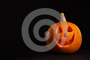 Pumpkin head on black background. Jack lantern - traditional Halloween decor