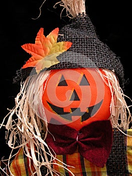 Pumpkin Headed Scarecrow on Black