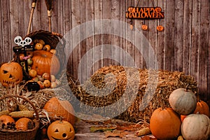 Pumpkin heads and autumn props wooden background