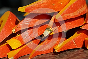 Pumpkin Hokkaido hollowed and cut in wedges and arranged on a heap.