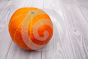 Pumpkin isolated on a wooden background