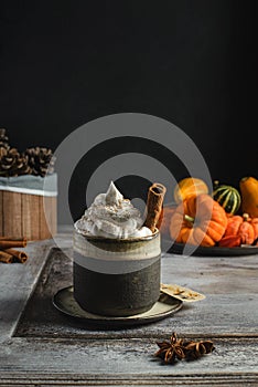 pumpkin latte with cinnamon and pumpkins
