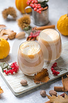 Pumpkin latte in a glasses. Autumn drink for Halloween or Thanksgiving