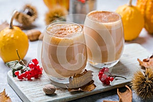Pumpkin latte in a glasses. Autumn drink for Halloween or Thanksgiving
