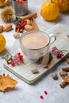 Pumpkin latte in mug. Autumn drink for Halloween or Thanksgiving