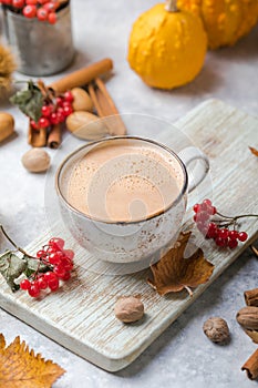 Pumpkin latte in mug. Autumn drink for Halloween or Thanksgiving