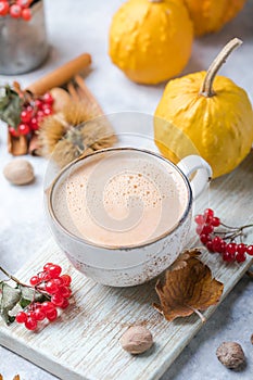 Pumpkin latte in mug. Autumn drink for Halloween or Thanksgiving