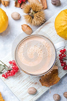 Pumpkin latte in mug. Autumn drink for Halloween or Thanksgiving