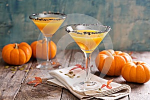 Pumpkin martini cocktail with black salt rim