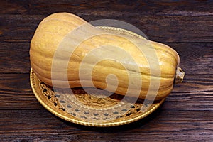 A pumpkin Matilda on a wooden table. Wooden background photo