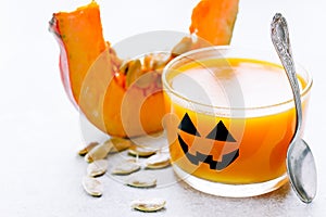 Pumpkin orange jelly or panna cotta in glass for Halloween party