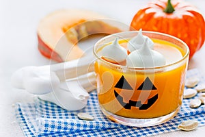 Pumpkin orange jelly or panna cotta in glass for Halloween party dessert for kids