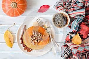 Pumpkin pancakes with pecan nuts and honey