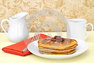 Pumpkin pancakes, pecans, and coffee.