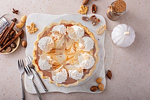 Pumpkin pie with cheesecake swirl, dessert variation for Thanksgiving