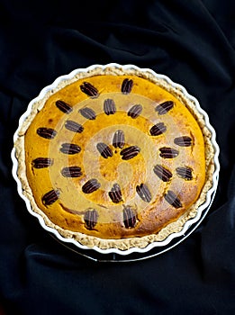 Pumpkin pie with pecan nuts