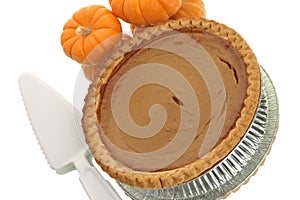 Pumpkin pie with serving utensil