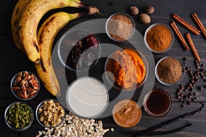 Pumpkin Pie Smoothie Bowl Ingredients on a Wooden Table