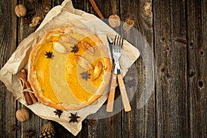 Pumpkin pie on a wooden table. Thanksgiving pie. Homemade baking. Copy space