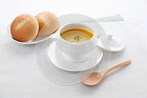 pumpkin potage soup isolated on table