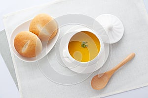 pumpkin potage soup isolated on table