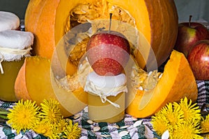 Pumpkin puree (or jam) with apple on a background of cut pumpkin