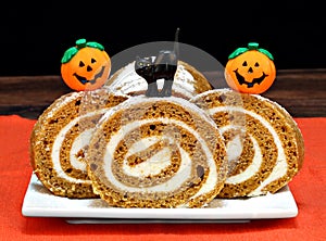 Pumpkin Roll Cake decorated for Halloween