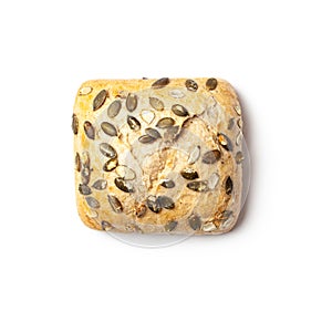 Pumpkin seed bread roll on white