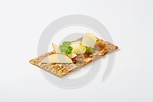 Pumpkin seed cracker with butter and apple