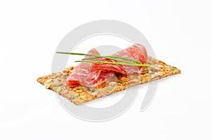 Pumpkin seed cracker with dry salami