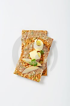 Pumpkin seed crackers with butter and apple