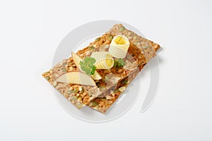 Pumpkin seed crackers with butter and apple