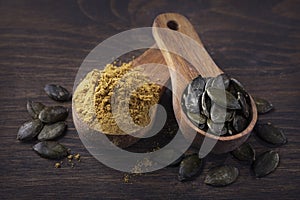 Pumpkin seed flour in a wooden spoon