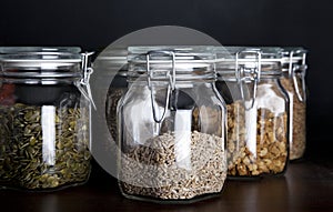 Pumpkin seed, sunflower seed and mulberries in glass jars