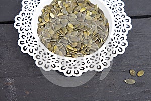 Pumpkin seed in white bowl