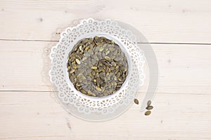 Pumpkin seed in white bowl