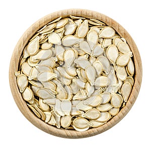 Pumpkin seeds in bowl isolated