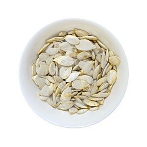 Pumpkin seeds bowl isolated on white