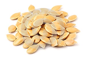 Pumpkin seeds closeup isolated.